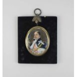 An early 19th century oval miniature portrait of a gentleman wearing a pink sash and gold chain,