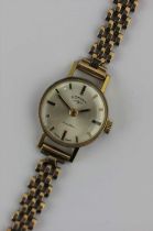 A Rotary gilt metal fronted and steel backed ladies wristwatch fitted to a 9ct gold bracelet