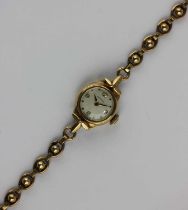 A Certina 9ct gold ladies bracelet wristwatch, the signed circular silvered dial with gilt Arabic