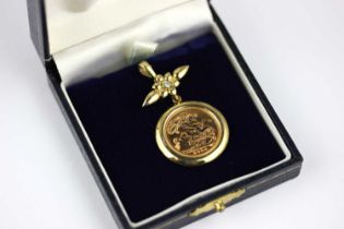 A 9ct gold pendant mounted with an Elizabeth II half sovereign 2003, the suspension with a