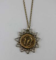 A 9ct gold pendant mounted with a George V sovereign 1911, with a gold neckchain, gross weight 13.
