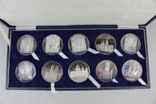 A cased set of ten Slade Hampton's silver Cathedral medallions, Birmingham 1974, 36oz, with booklet