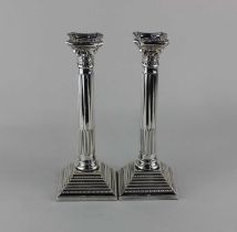 A pair of Elkington & Co silver plated Corinthian column candlesticks, 27cm high, by repute