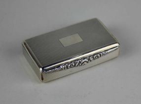 A modern silver snuff box with floral cast thumb plate, engine turned engraved decoration and gilt