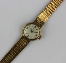 An Omega 9ct gold ladies bracelet wristwatch, the signed silvered dial with gilt Arabic and baton