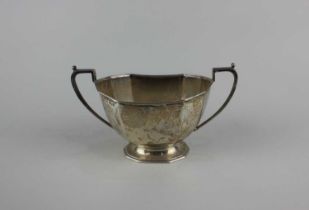 A George VI Art Deco silver two handled sugar bowl facetted oval form, maker Frank Cobb & Co Ltd,