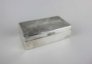 A George V silver rectangular cigarette box with engine turned engraving, maker Adie Brothers,