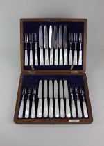 A cased set of twelve pairs of silver plated dessert knives and forks with mother of pearl