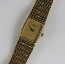 A Raymond Weil quartz gold plated ladies bracelet wristwatch having a curved rectangular brushed