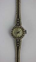 A Gublin white gold and diamond lady's dress wristwatch, the signed silvered dial with Arabic and