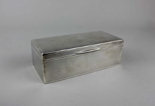 A George V silver cigarette box rectangular shape with engine turned engraved decoration,