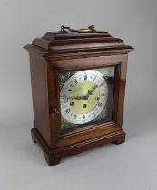 A Franz Hermle mahogany cased mantle clock, the brass dial with silvered chapter ring and Roman