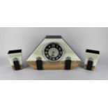 An Art Deco style three piece clock garniture with green onyx and chrome metal detail, the