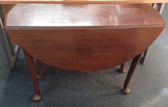 A 19th century oval mahogany drop leaf dining table on tapered legs to pad feet 103cm