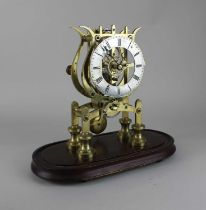 A brass skeleton clock with fusee movement, silvered chapter ring with Roman numerals, 24cm high,