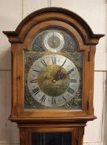 A 20th century longcase clock in a mahogany case with an arched pediment and glazed case door, brass