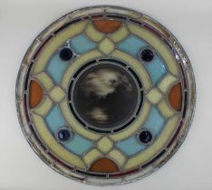 Manner of Swaine Bourne and Son, Birmingham, a circular stained glass leaded window, the central