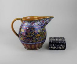 An Italian Gualdo lustre glaze jug floral and dragon decoration with a panel of a head in profile,