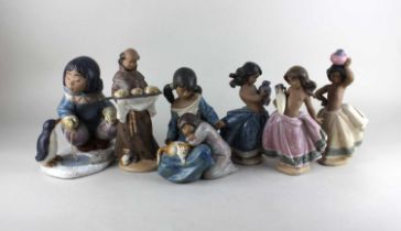 Six Lladro gres finish porcelain figures to include an eskimo fishing beside a penguin 21cm high,