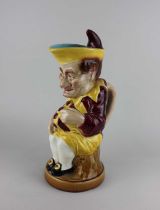 A Sarreguemines majolica 'Mr Punch' character jug / pitcher 33cm high