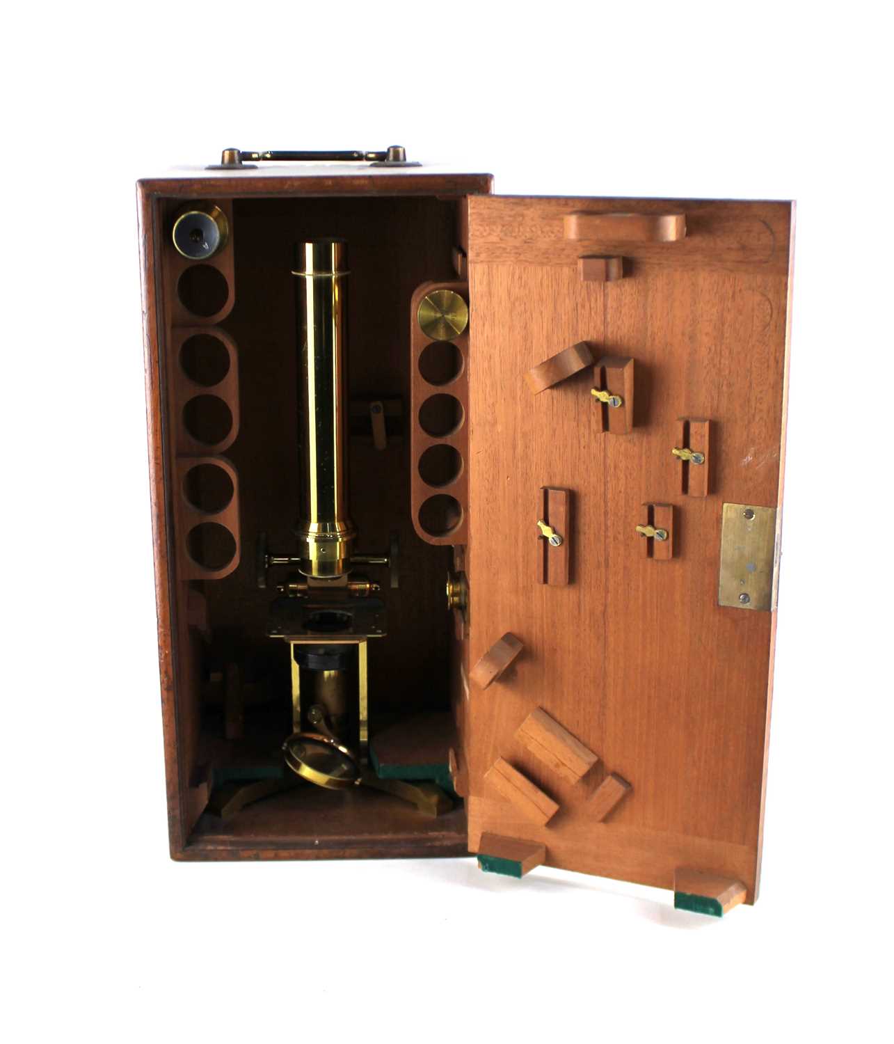 A Ross London brass microscope inscribed Ross London 4056, in fitted wooden case with key