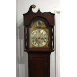 An oak longcase clock, the bell striking movement with brass and silvered break-arch dial