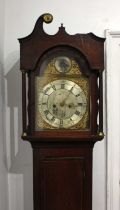 An oak longcase clock, the bell striking movement with brass and silvered break-arch dial