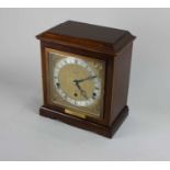 An Elliott mahogany cased chiming mantle clock retailed by W Perry & Co Birmingham, presented to