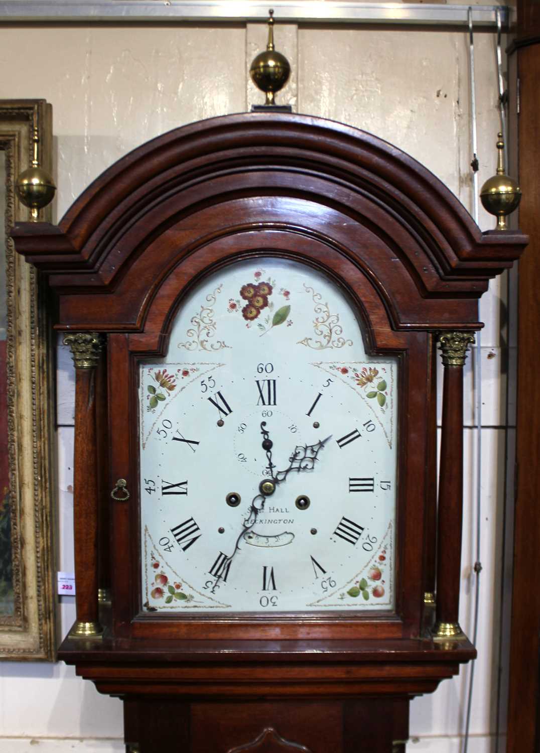 A mahogany 8 day longcase clock, striking on the hour and half past, the painted break arch dial
