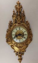 A French gilt metal wall clock, the Mougin movement striking on a bell, the 5" dial with Roman