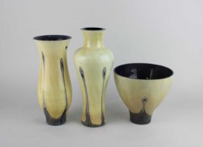 A Caithness art glass 'Ebony' pattern 6650 fruit bowl 15cm diameter, 6651 tall vase 25cm high and