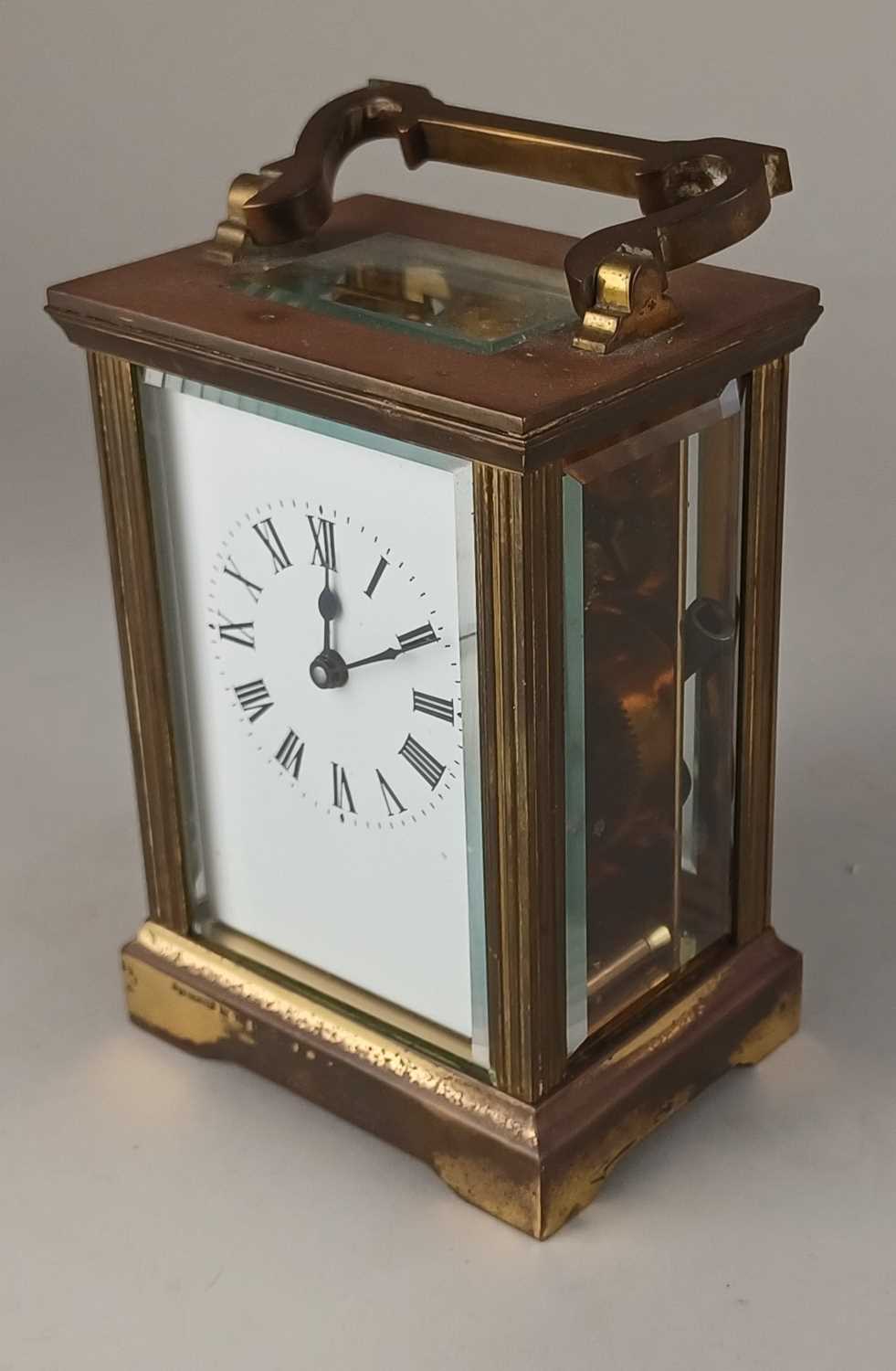A brass carriage clock white enamel dial with Roman numerals, presentation inscription, 15cm