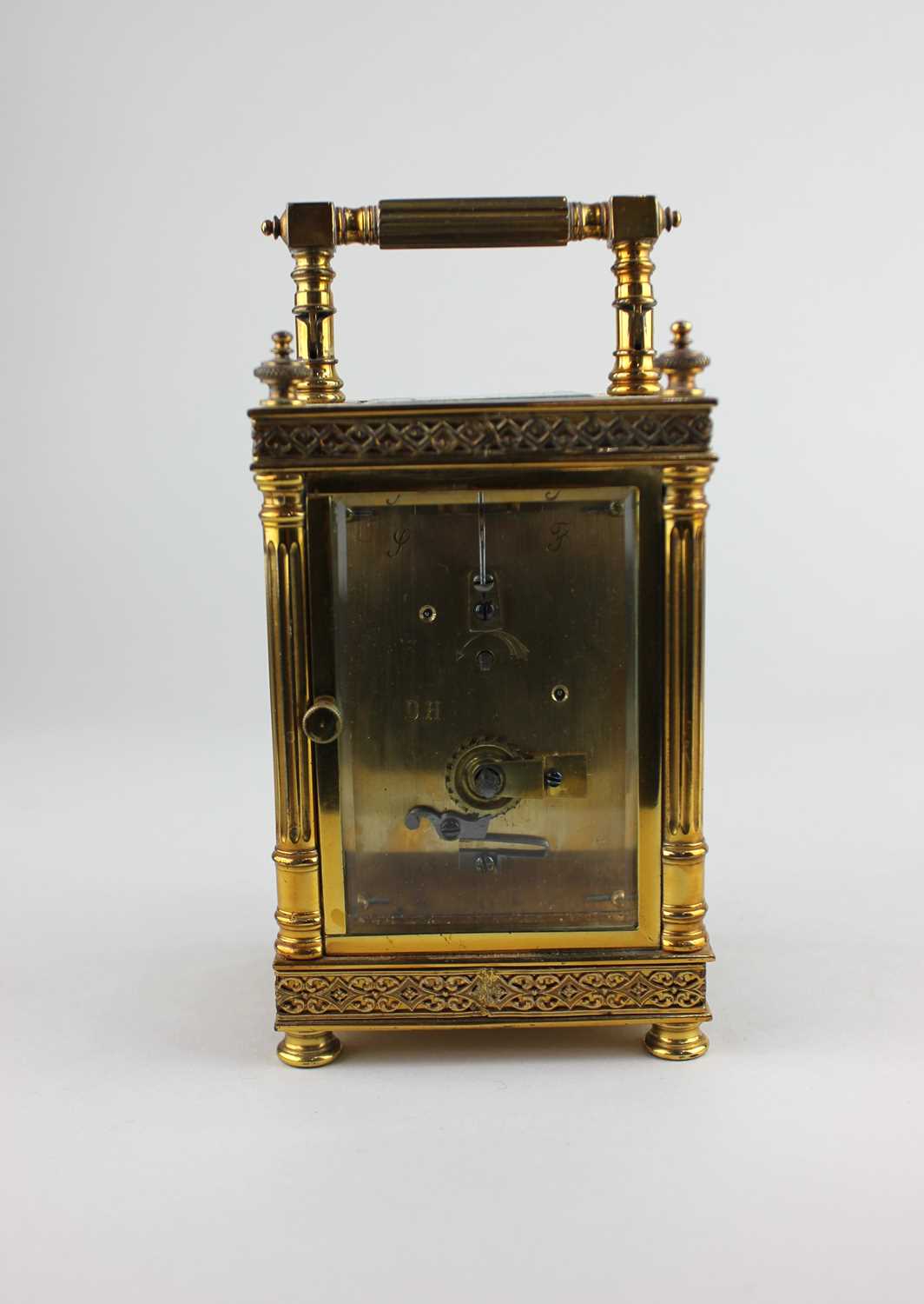 A gilt metal cased carriage clock, the architectural case with bevelled glass panels, white enamel - Image 4 of 5