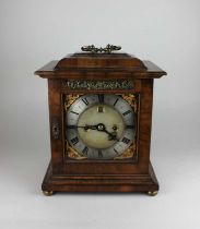 A George III style walnut bracket clock the six and a half inch dial with silvered chapter ring