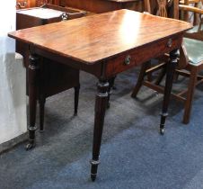 A Victorian mahogany side table the rectangular top with rounded corners above a drawer on turned