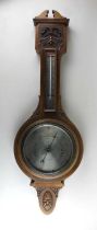 An Aitchinson & Co London carved wall barometer / thermometer 88cm
