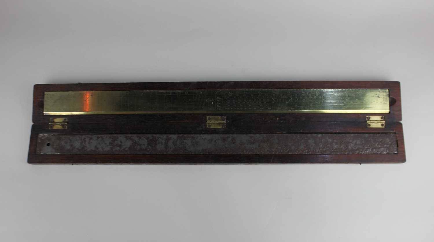 A 19th century Gunter 24 inch brass ruler with steel backing rod in original fitted case, by Elliott