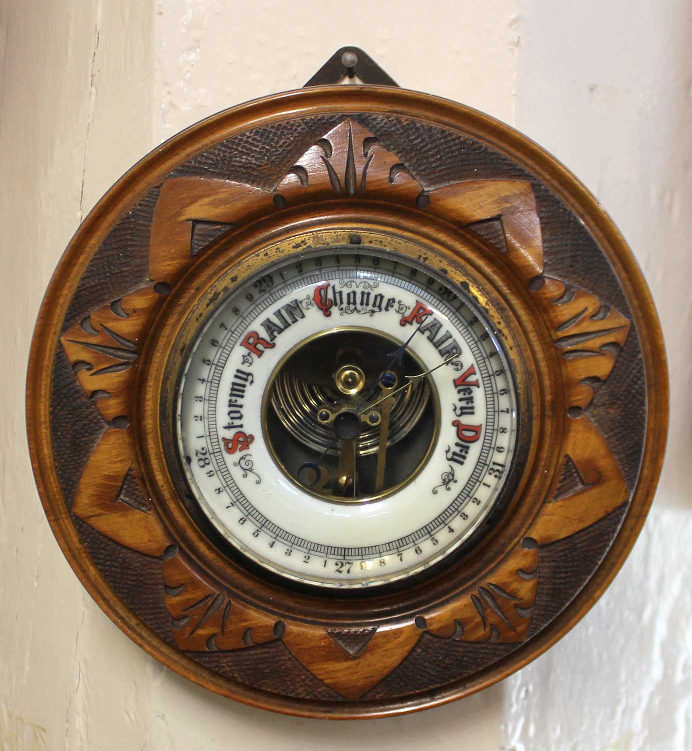 A Gischard circular carved wall barometer 19cm