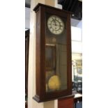A Vienna style oak cased wall clock, 78cm high, with pendulum, weight and key (glass a/f)