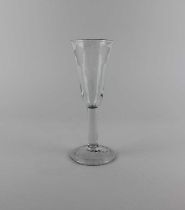 An 18th century ale glass the slender funnel bowl engraved with hops and barley, on plain stem to