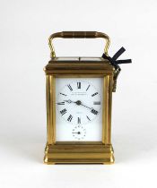 A 19th century gilt metal cased repeating carriage clock, the white enamel dial signed W Thornhill &
