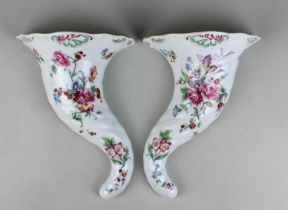 A pair of Royal Worcester porcelain wall pockets with floral decoration 22cm high