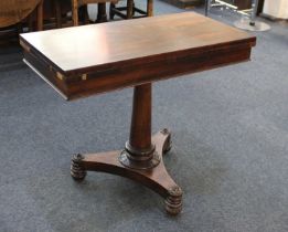 A 19th century rosewood card table, rectangular swivel top enclosing green baize lined interior,