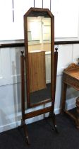 An oak framed cheval mirror on four curved feet and castors, 156cm