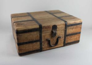 A metal bound wooden box with hinged lid