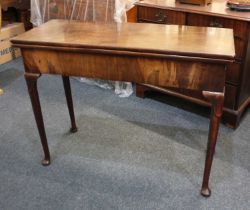 A 19th century mahogany rectangular tea table with fold over top, on tapered legs to pad feet 97cm