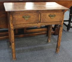 A George III oak rectangular side table with two drawers on square chamfered legs, 79cm