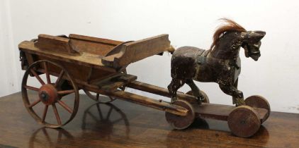 A wooden model of a horse and cart, the cart stamped 'Cubitt Builder &c' 28cm high (a/f)