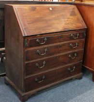 A George III mahogany bureau, the fall front enclosing fitted interior over four long graduated