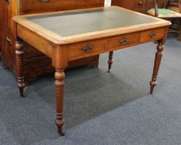 A Victorian mahogany writing desk the green leather inset rectangular top with moulded edge and